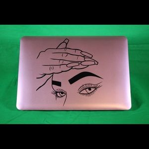 Rose Gold MacBook with vinyl artwork